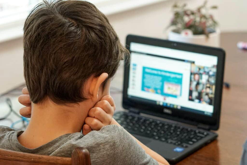 A child using the internet on a laptop.